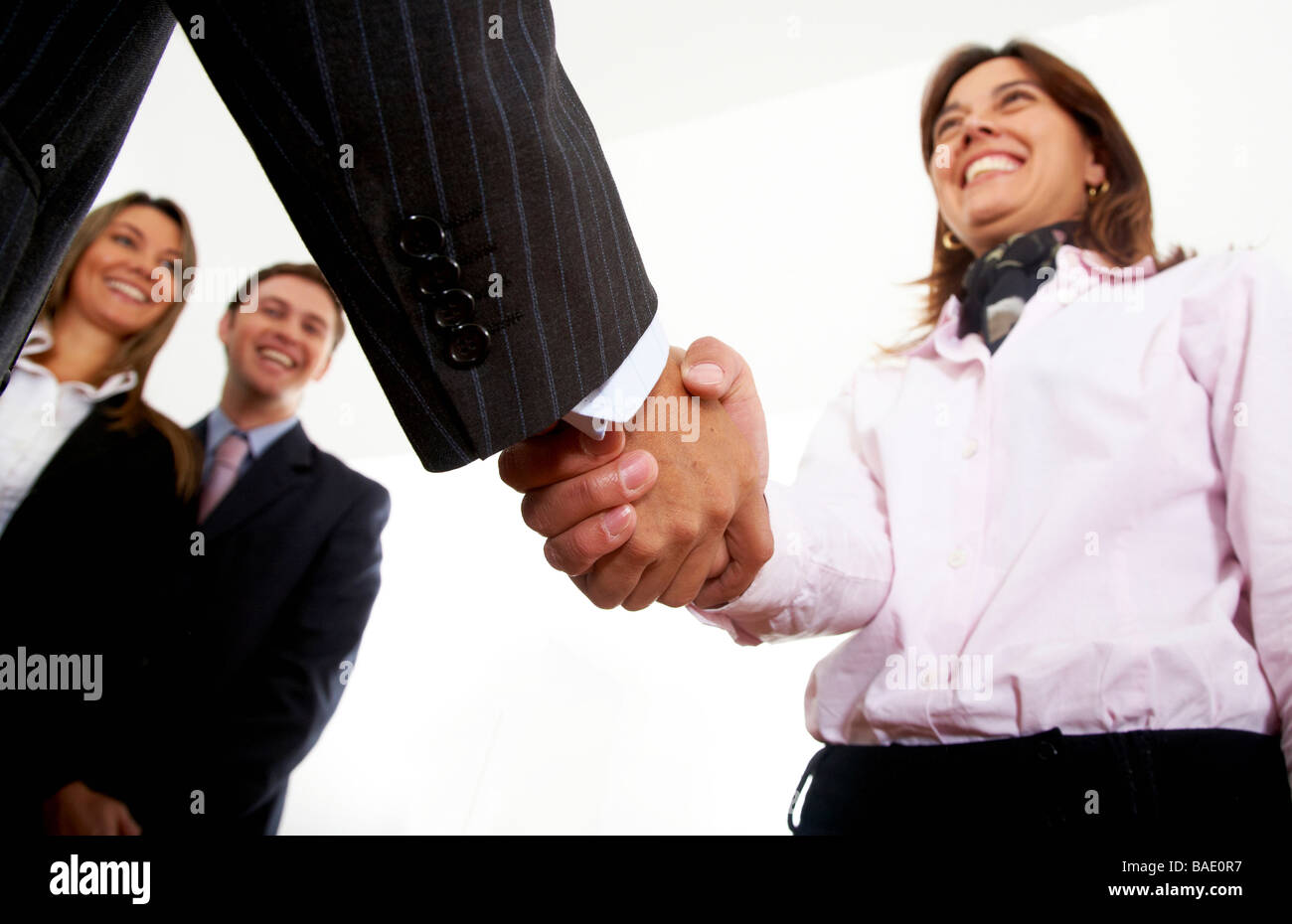 business handshake in an office to seal a partnership Stock Photo - Alamy