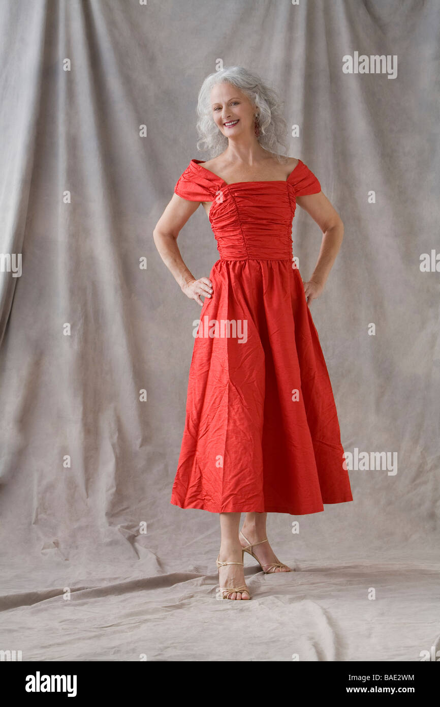 Mature Woman Wearing Red Dress Stock Photo