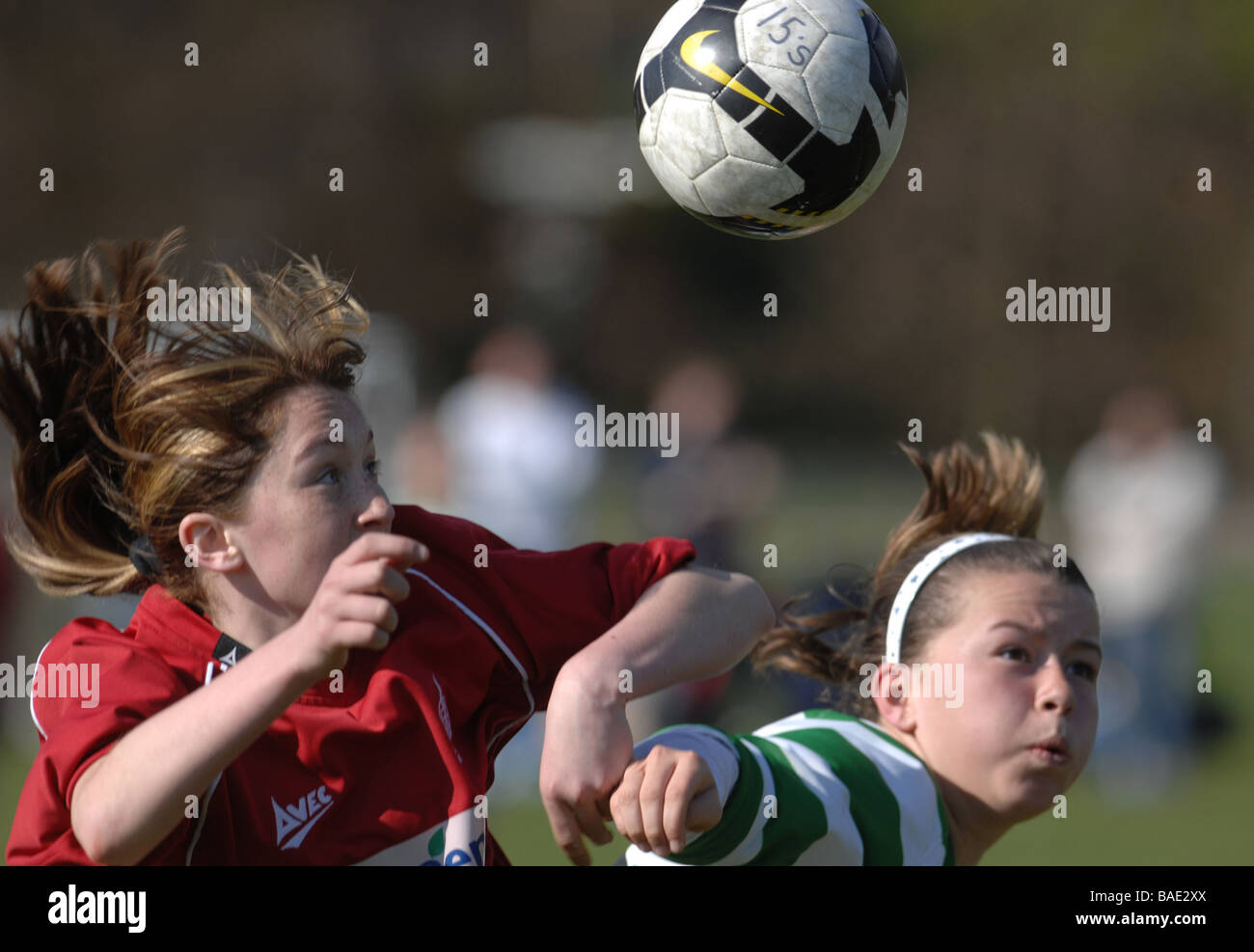 Football young girls female soccer action sport contest match football match tackle tackling shooting Stock Photo