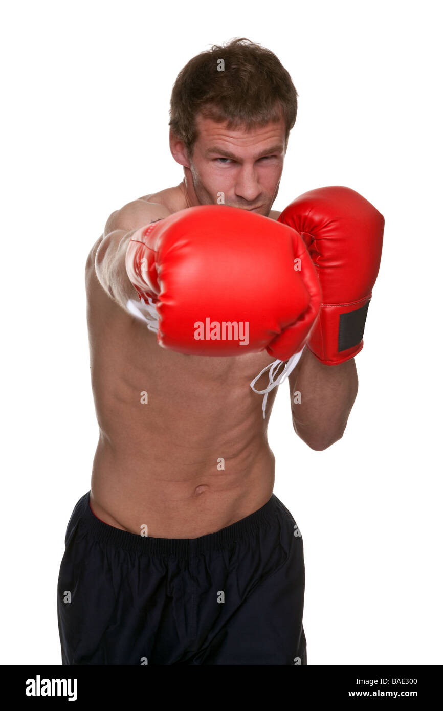 Male boxer delivering a knockout punch isolated on white background