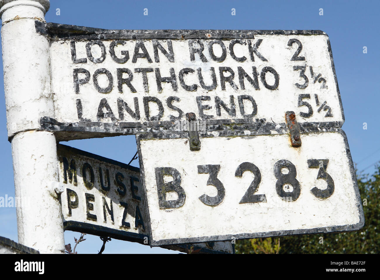 Cornwall old road sign pointing to Lands End Portchurno and Logan Rock along the B3283 Stock Photo