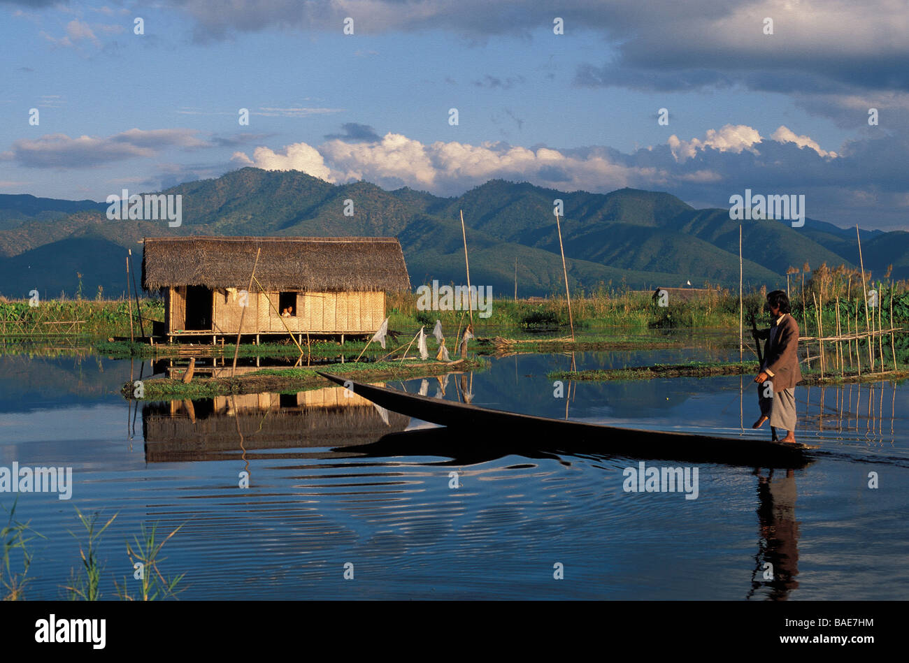 Myanmar (Burma), Shan State, Inle Lake,house on stilts and dugout in the foreground Stock Photo