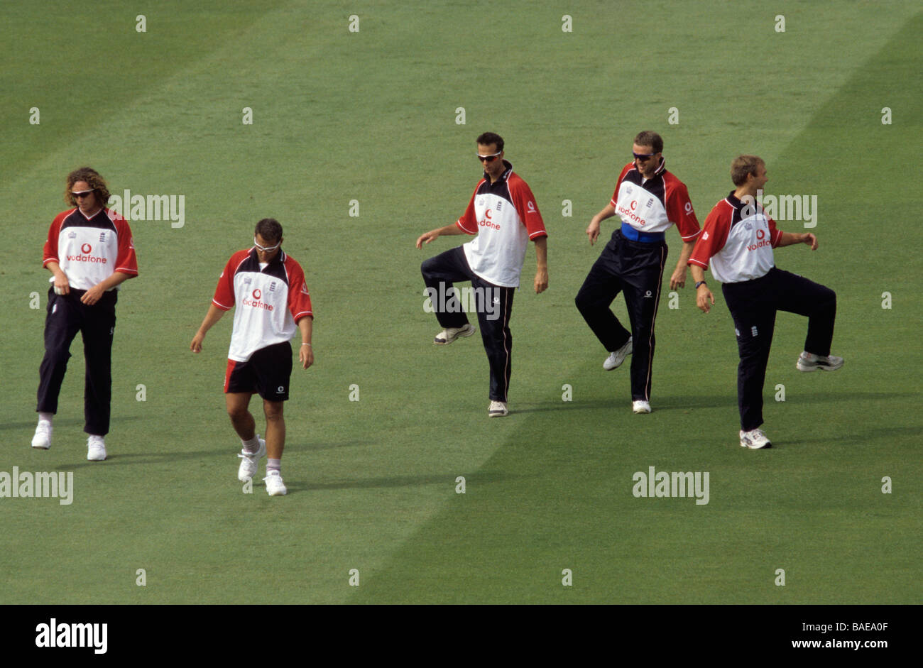England cricket team doing warming up exercises like a tribal dance on the cricket pitch at Lords before a match with Pakistan Stock Photo