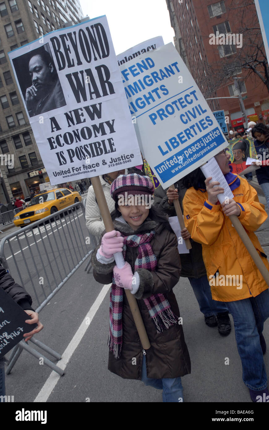 Several thousand peace activists march down Broadway and in front of the New York Stock Exchange on Saturday April 4 2009 Stock Photo