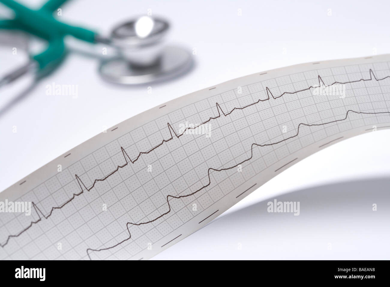 Regular electro cardiogram with a stethoscope Stock Photo