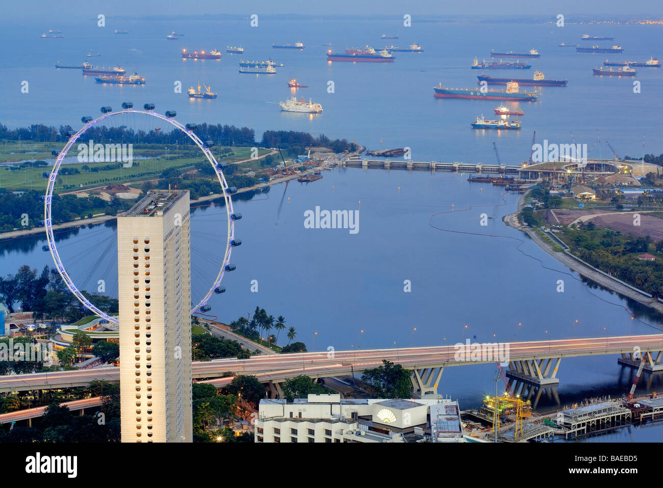 Singapore, overlooking Singapore Flyer and boats in the Strait of Singapore since the New Asia Bar of the Swisshotel Stock Photo