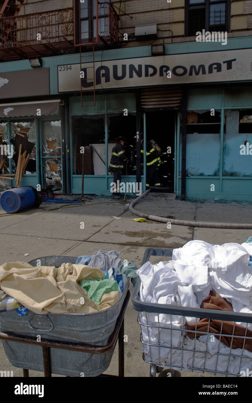 FDNY firefighters at an all hands fire in a laundromat in Harlem in New York Stock Photo