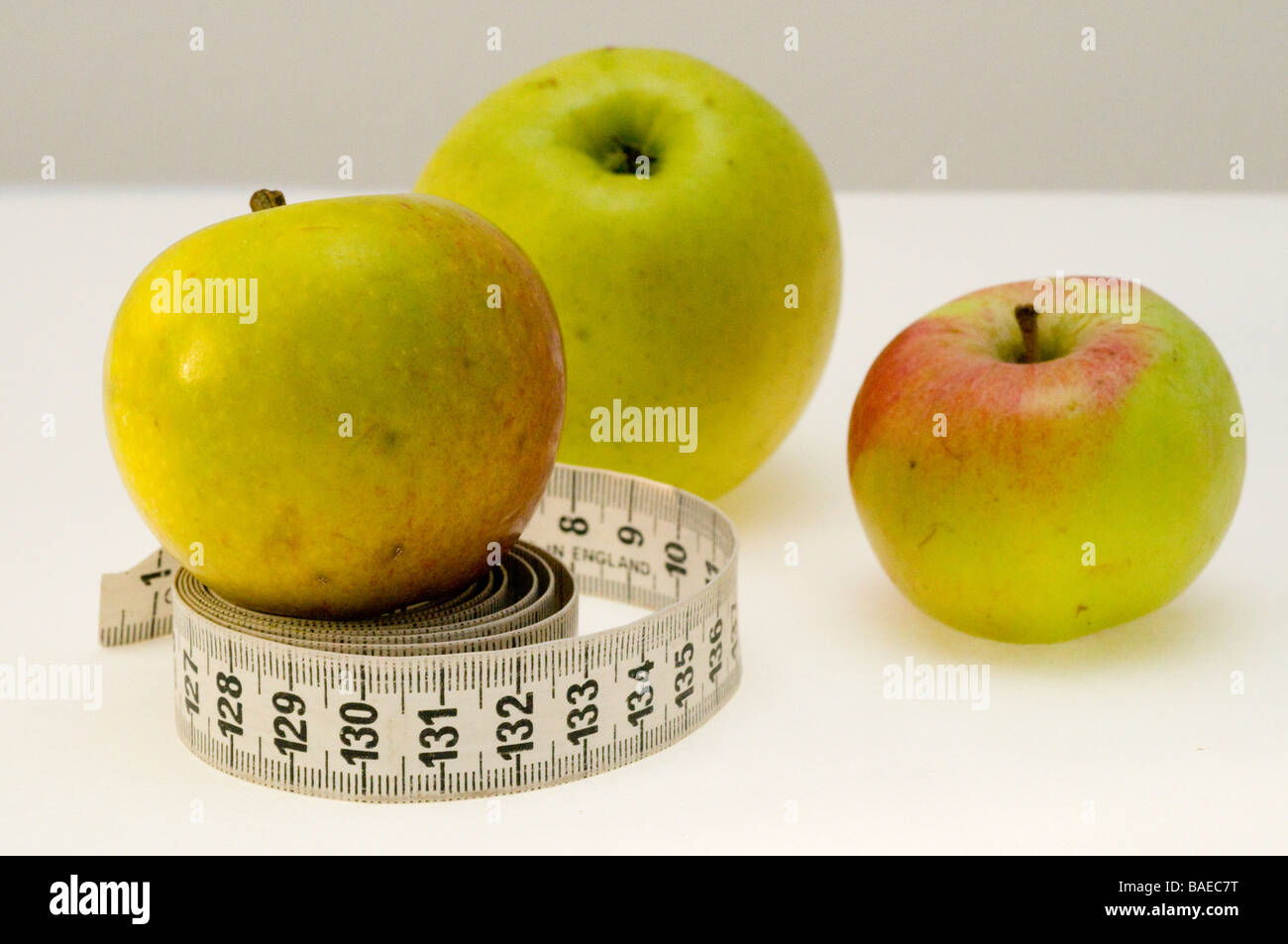Apples and a tape measure. Stock Photo