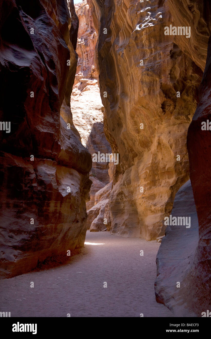 Al-Siq the gorge leading to The Treasury, the most famous building in the ancient city of Petra, Jordan Stock Photo