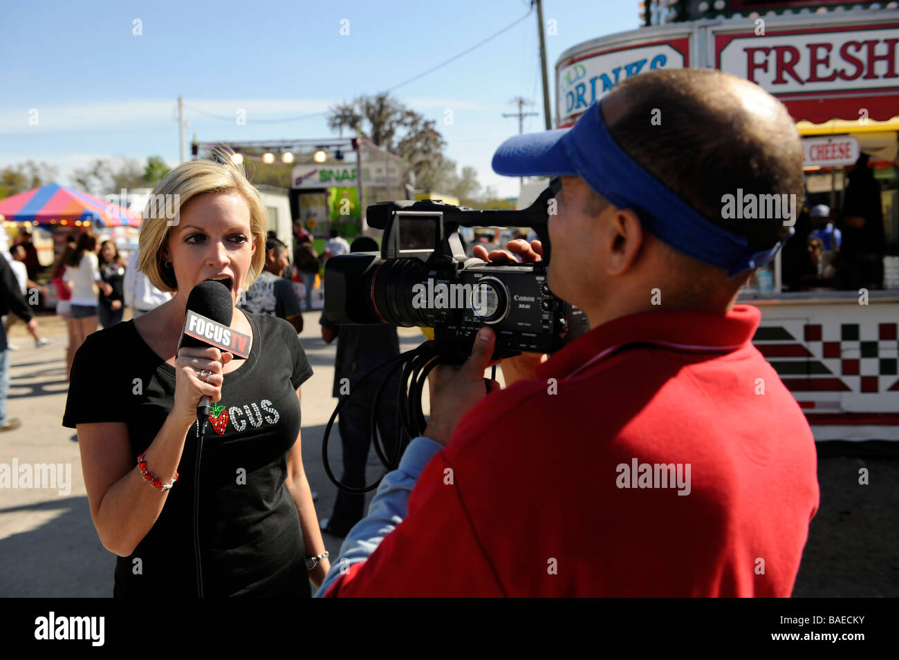 White female news reporter at Strawberry Festival Plant City Florida