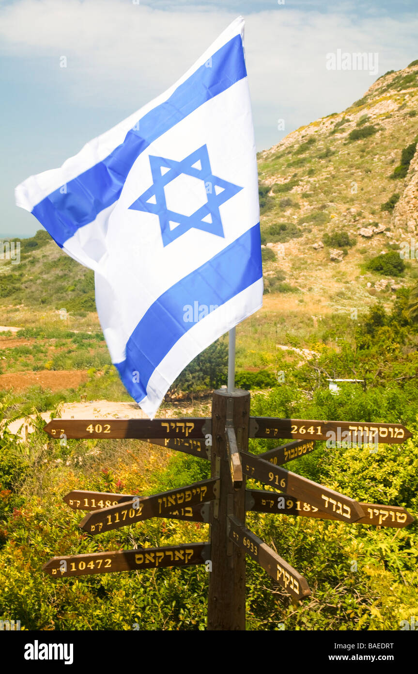 Israel Maagan Michael Israeli flag on top of distance signs to various capitol cities around the world Stock Photo