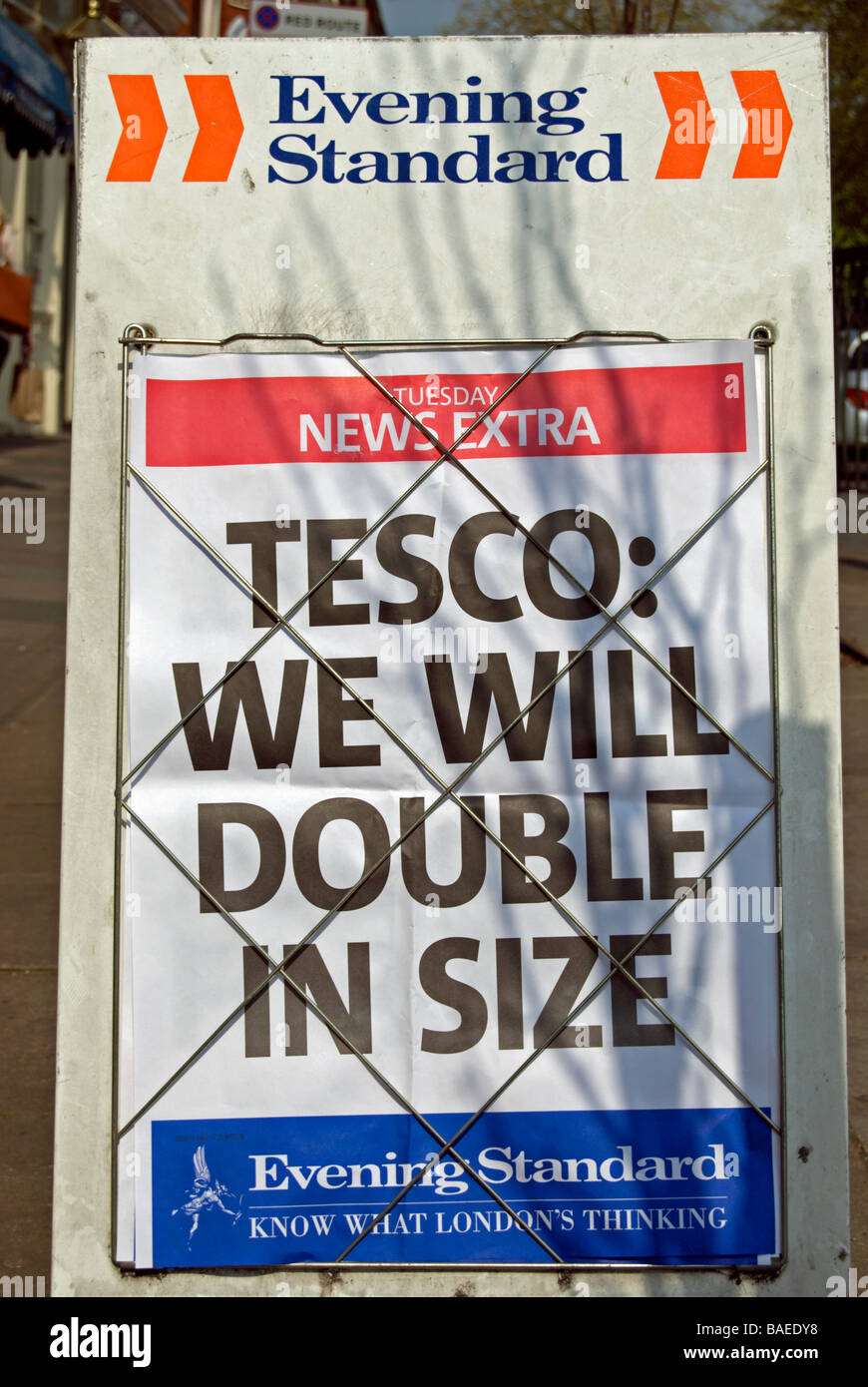 tesco will double in size, announced on a street stand for london's evening standard newspaper Stock Photo