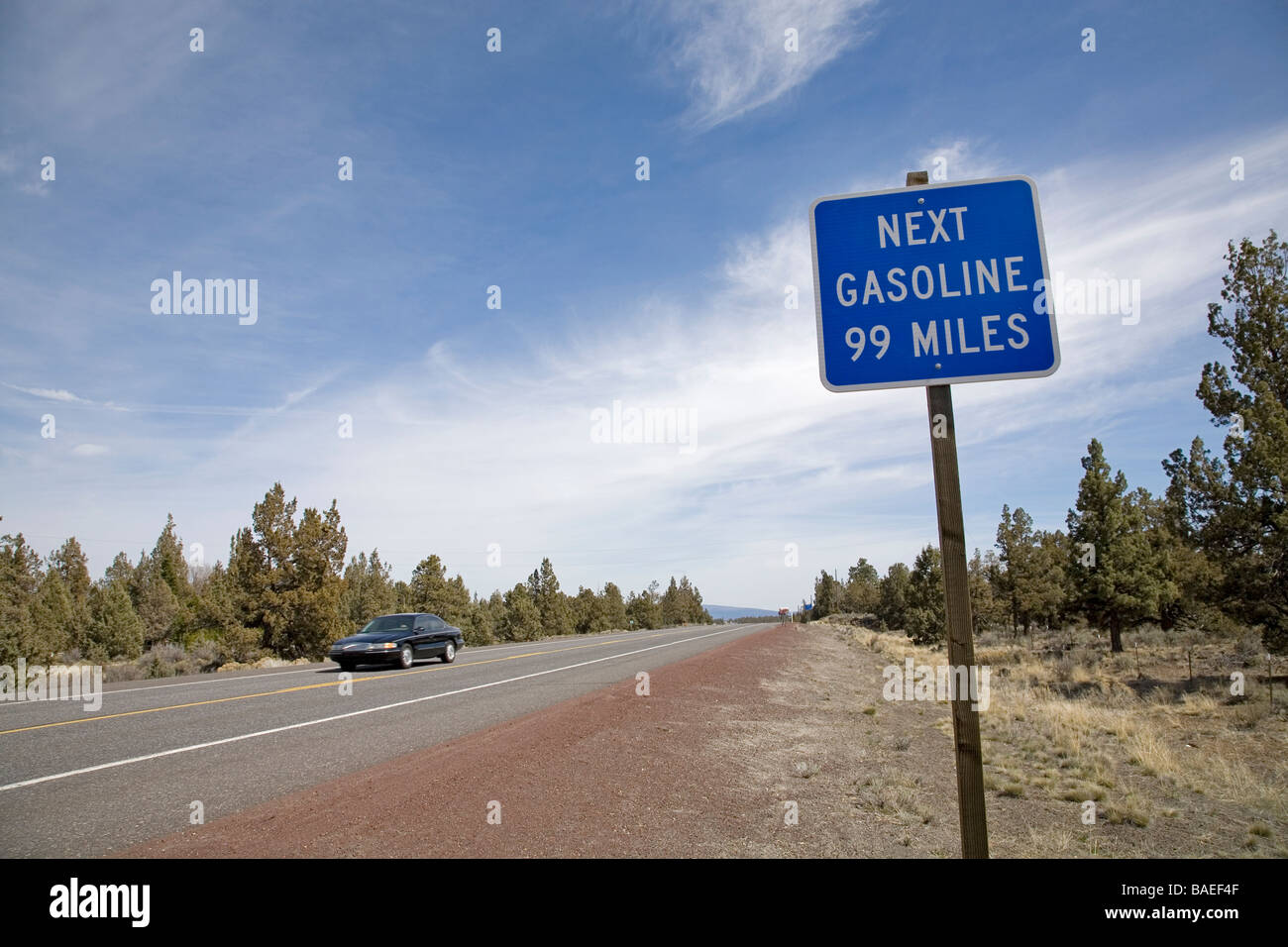 USA OREGON A sign in the high desert of central Oregon telling motorists that the next gasoline station is 99 miles away Stock Photo