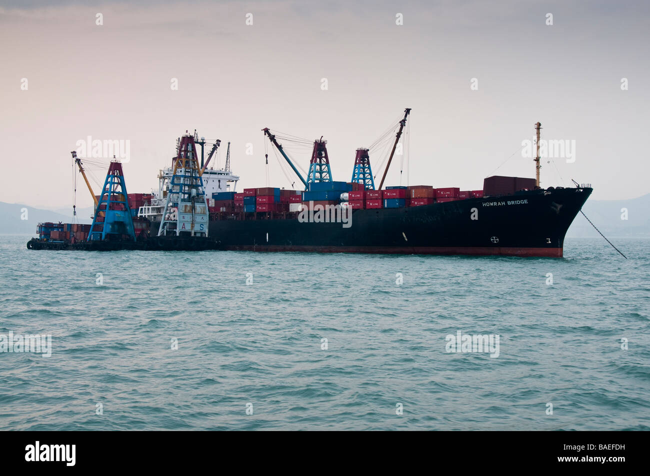 Container ship offloading. Stock Photo