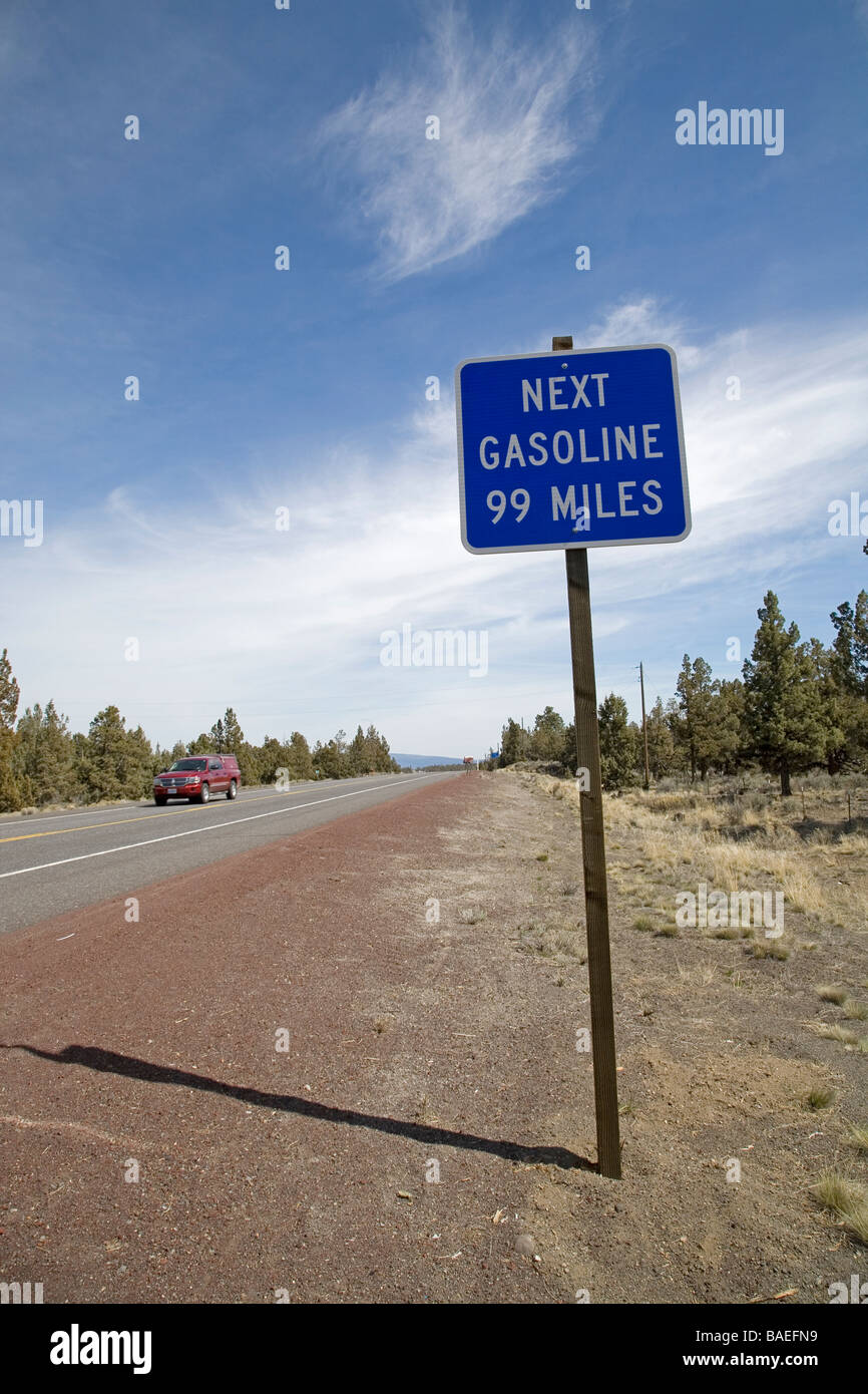 A sign in the high desert of central Oregon telling motorists that the next gasoline station is 99 miles away Stock Photo