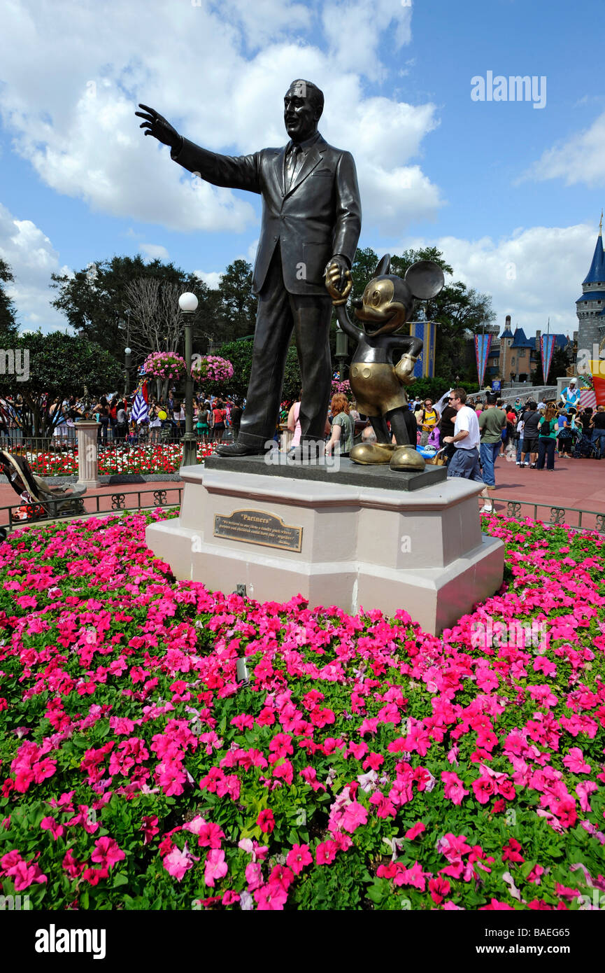 Statue of Walt Disney and Mickey Mouse in front of Cinderella Castle at Magic Kingdom Theme Park Orlando Florida Central Stock Photo