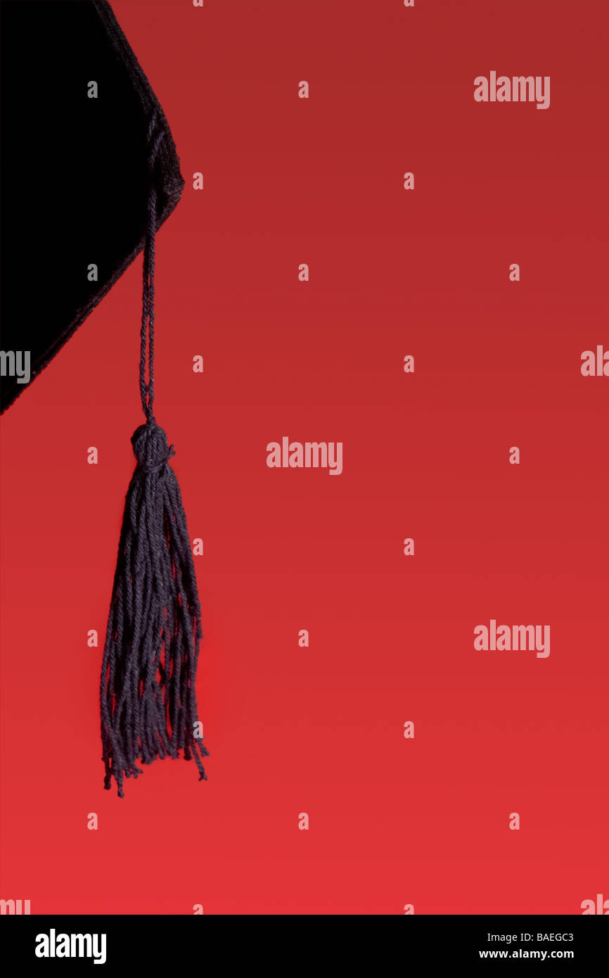 Detail of a graduation tassel against a red background Stock Photo Alamy