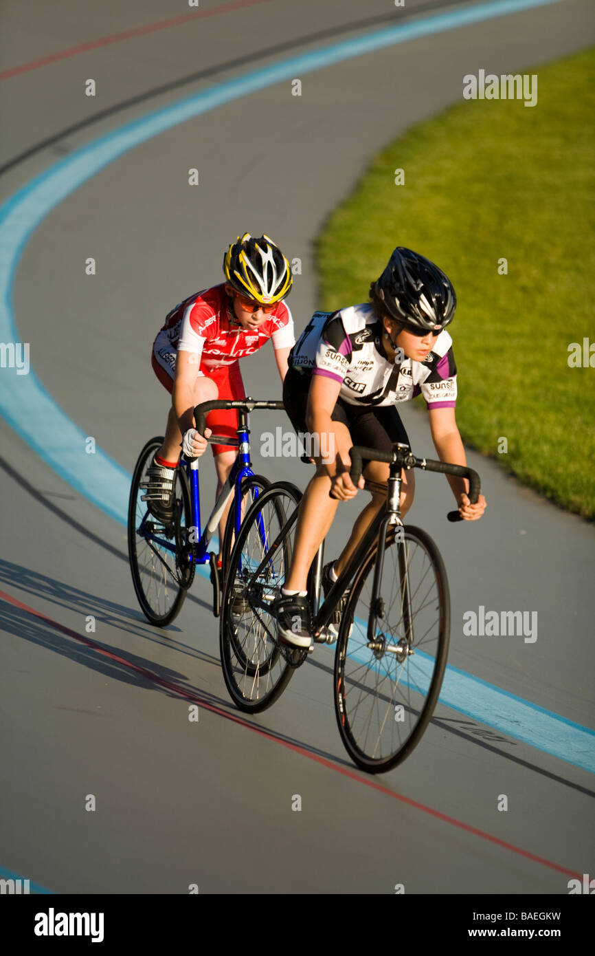 ILLINOIS Northbrook Two young male bicyclists in bicycle race at velodrome track Stock Photo