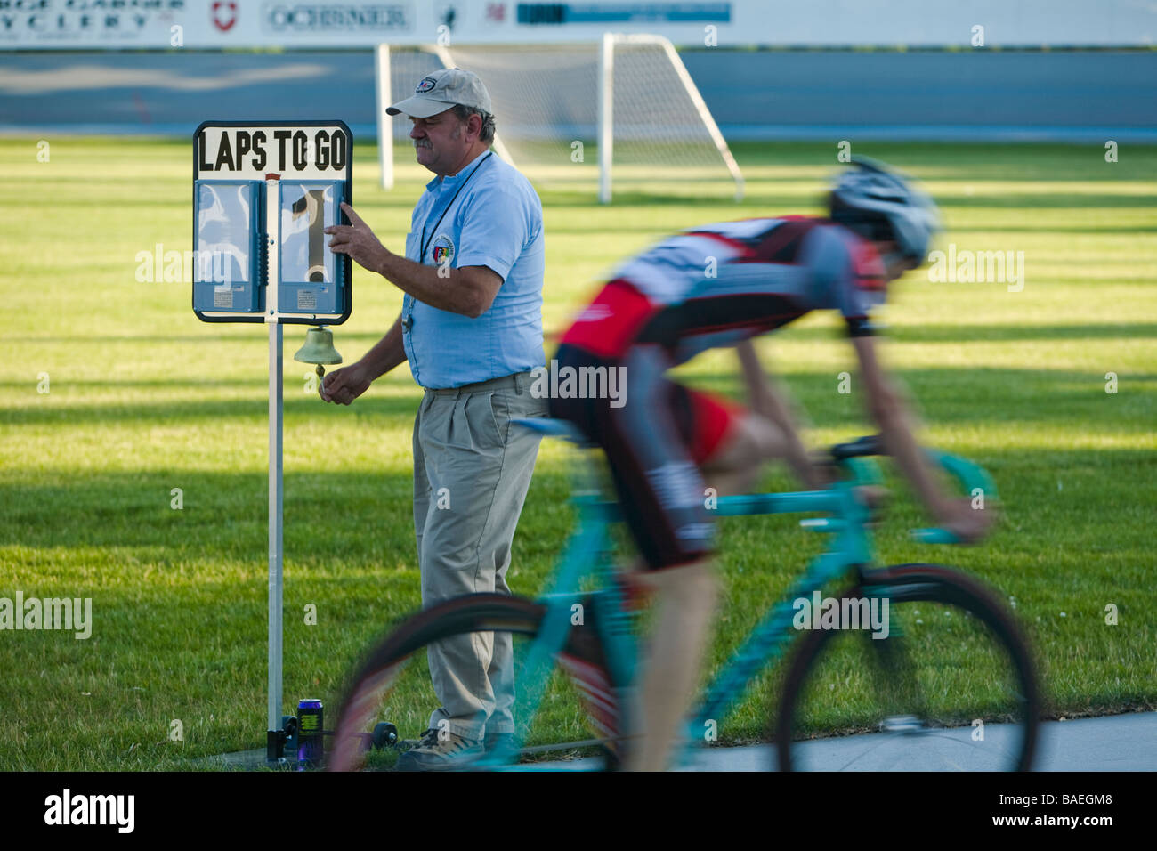 ILLINOIS Northbrook Race judge stand at laps to go sign at bicycle race at velodrome track Stock Photo