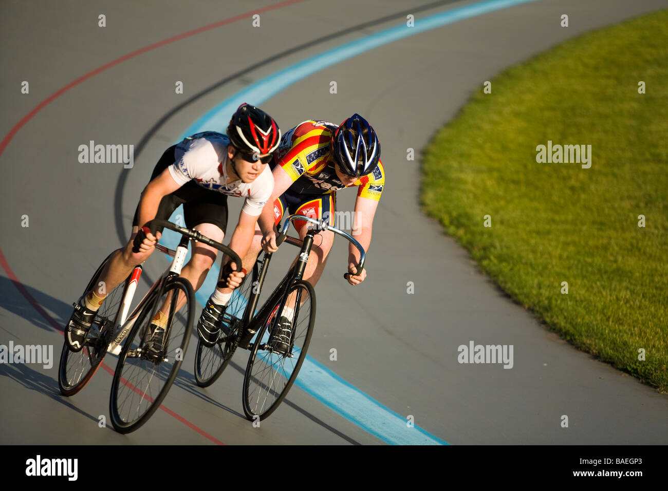 ILLINOIS Northbrook Two young male bicyclists in bicycle race at velodrome track Stock Photo