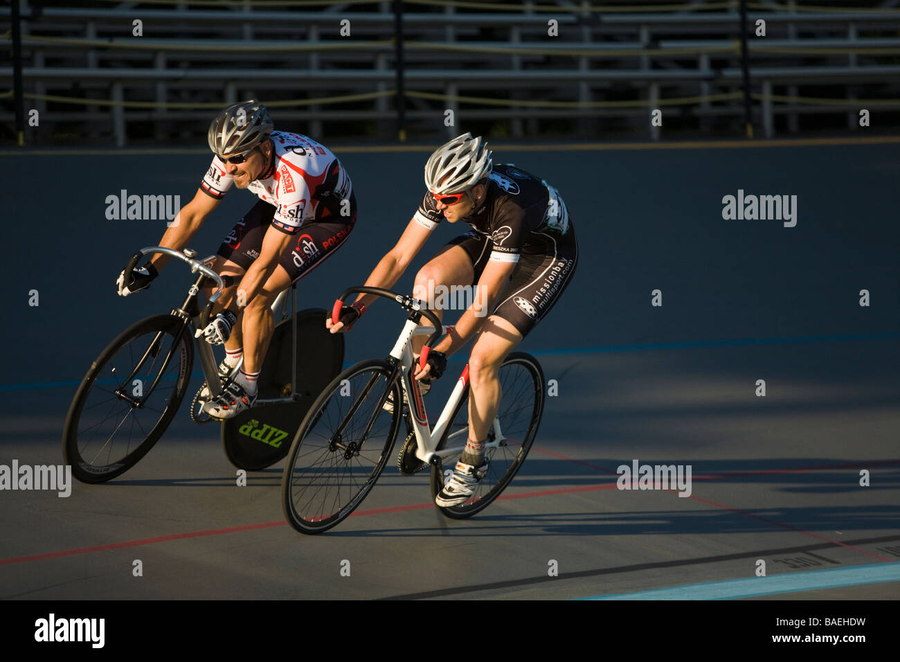 ILLINOIS Northbrook Two adult male cyclists sprint during bicycle race at velodrome track Stock Photo