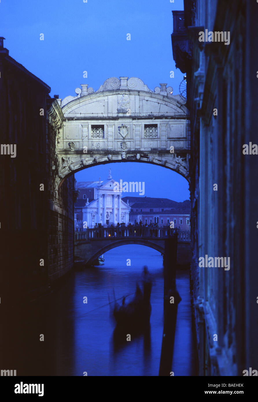 Gondola under Bridge of Sighs at night San Giorgio Maggiore in background San Marco sestier Venice Veneto Italy Stock Photo