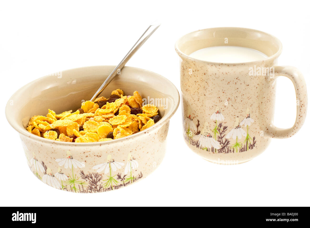 cornflakes with milk in a cup on a white background Stock Photo - Alamy