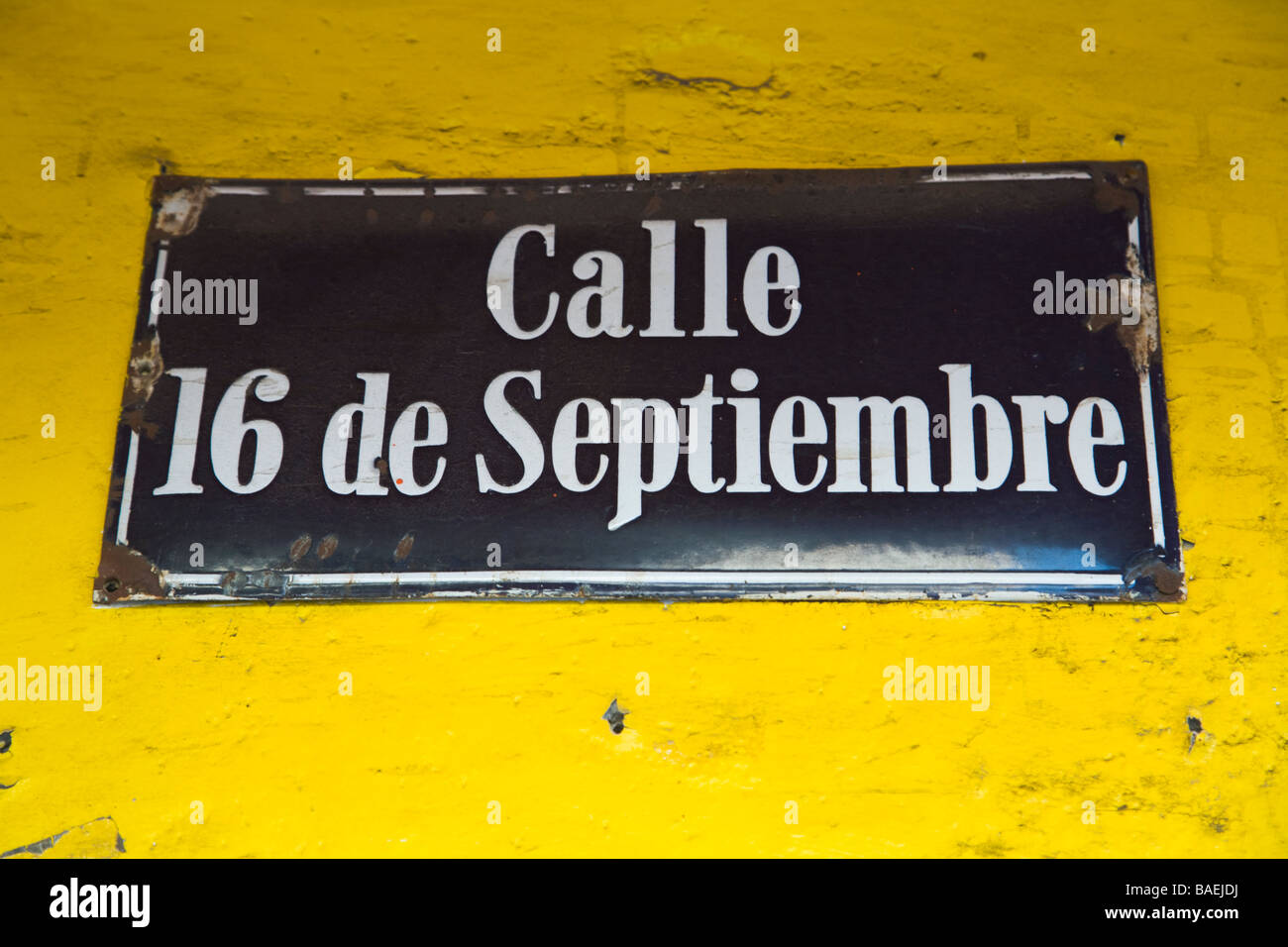 MEXICO La Paz Calle 16 de Septiembre street sign posted on yellow building 16 of September street in Spanish Stock Photo