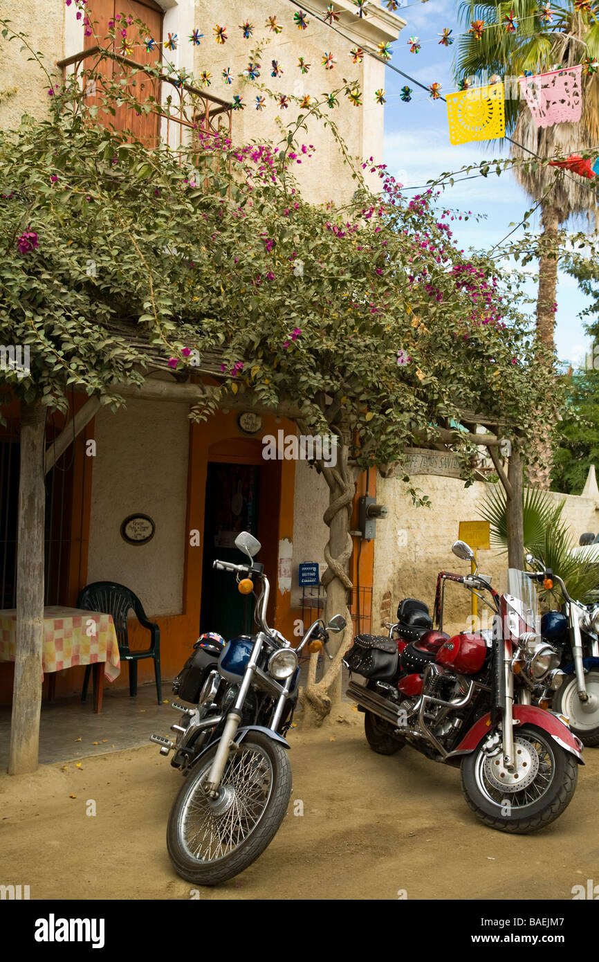 MEXICO Todos Santos Motorcycles parked outside cafe and restaurant in small Mexican town Stock Photo