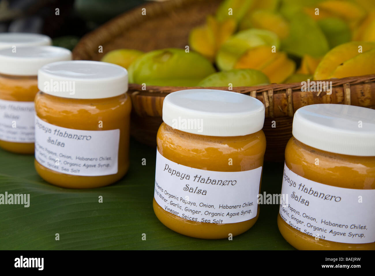 MEXICO Todos Santos Roadside stand selling organic fruits and vegetables in small Mexican town jars of papaya habanero salsa Stock Photo