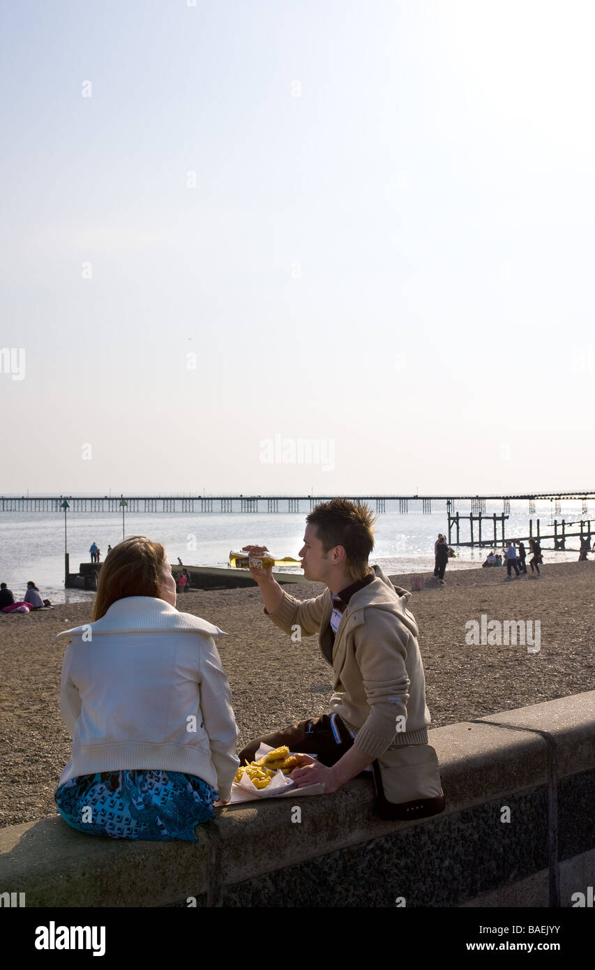Two people eating fish and chips on Southend seafront in Essex.  Photo by Gordon Scammell Stock Photo
