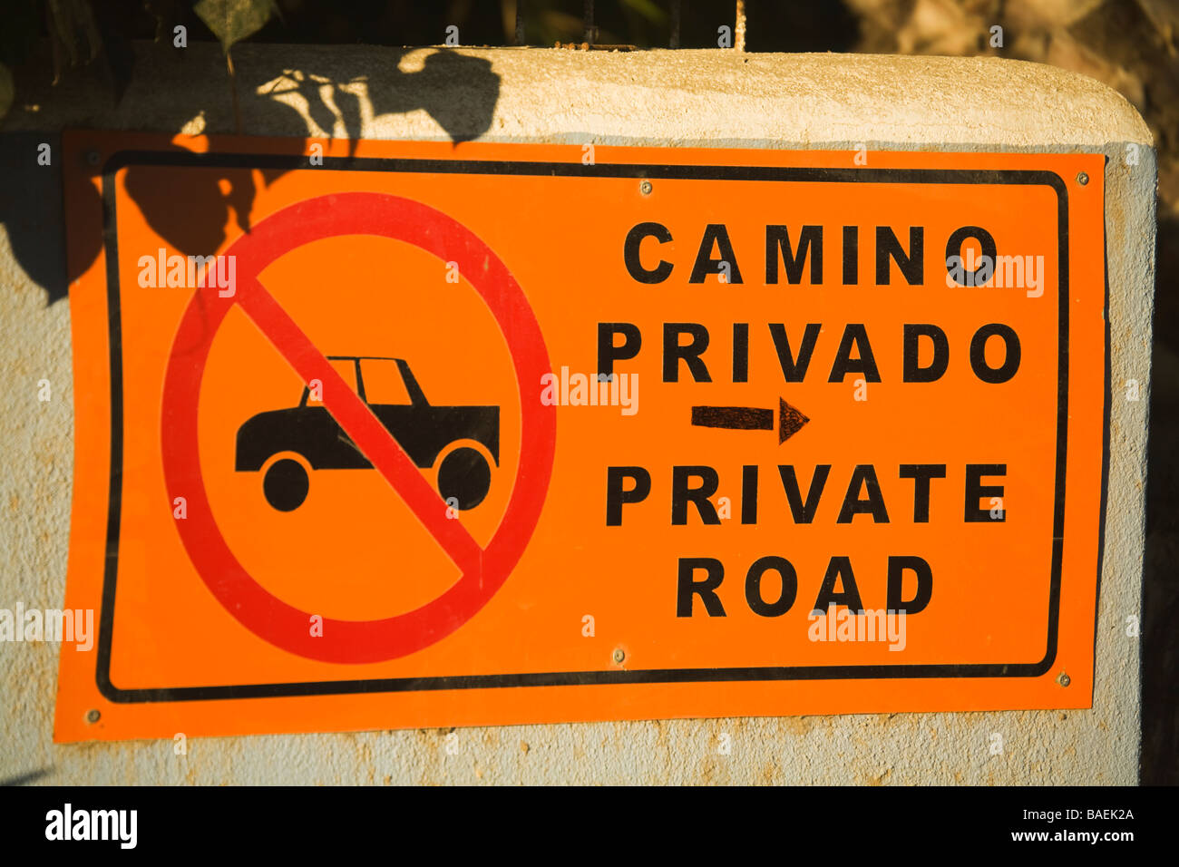 MEXICO Todos Santos Sign for private road in English and Spanish red circle with slash through truck Stock Photo