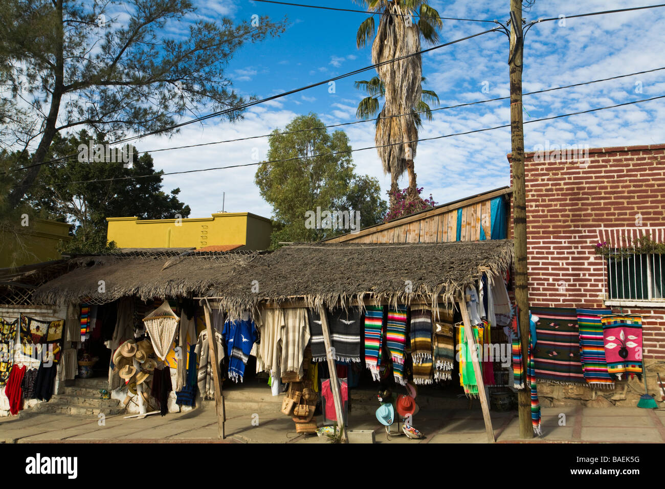 MEXICO Todos Santos Exterior of retail store selling fabrics serapes and blankets along small