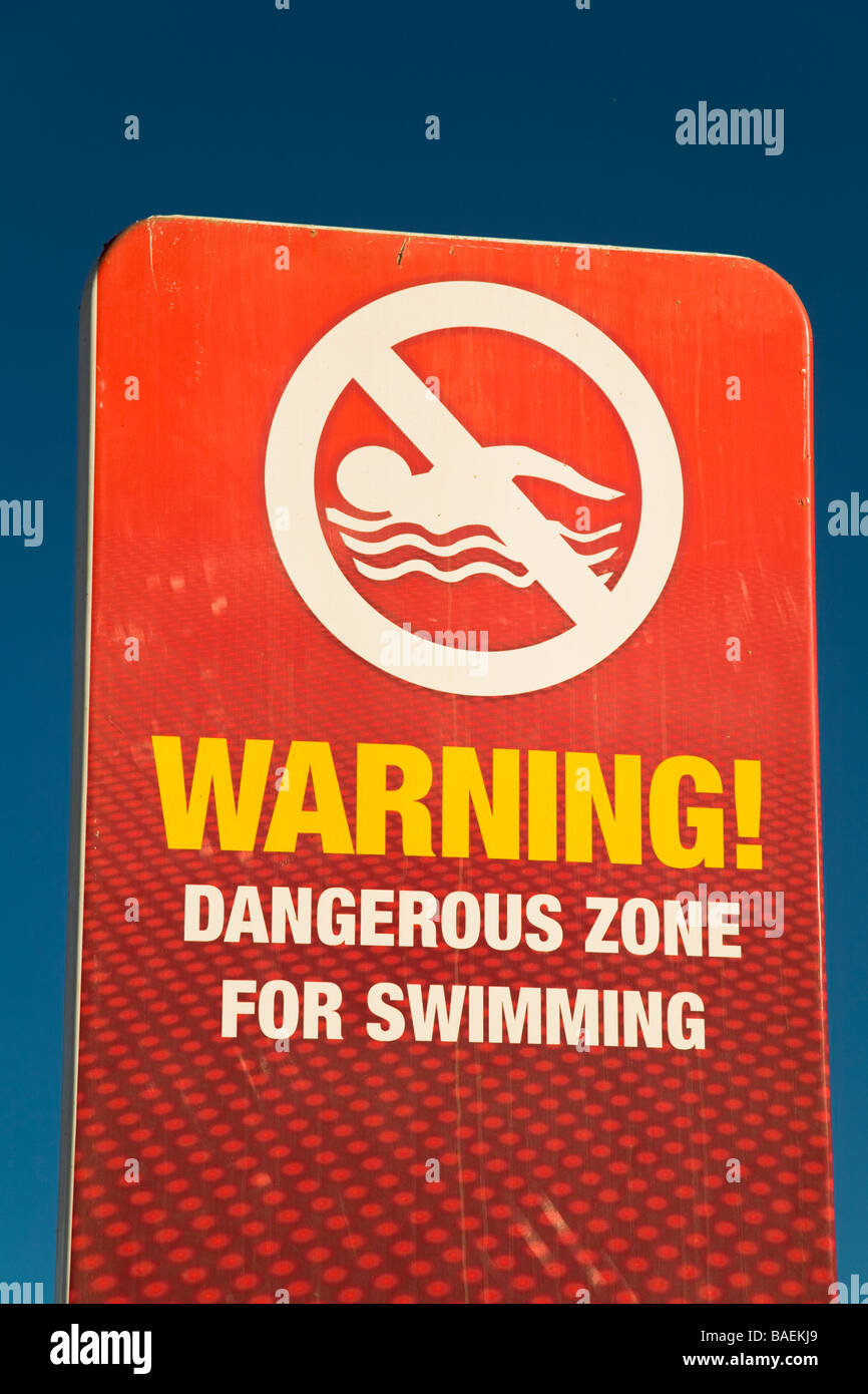MEXICO San Jose del Cabo Warning sign on beach in English dangerous zone for swimming Stock Photo