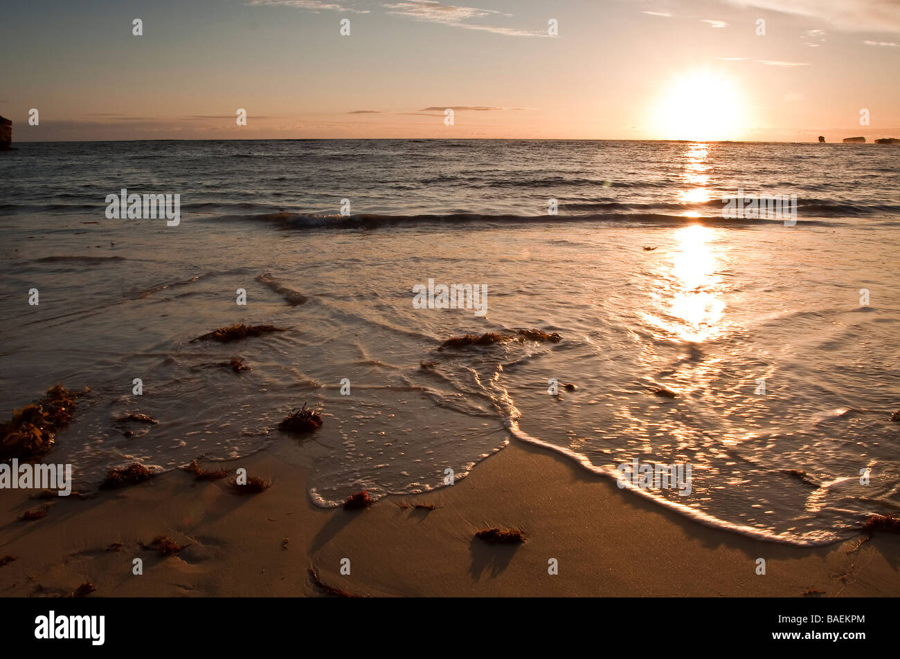 Sunset over a bay Stock Photo - Alamy