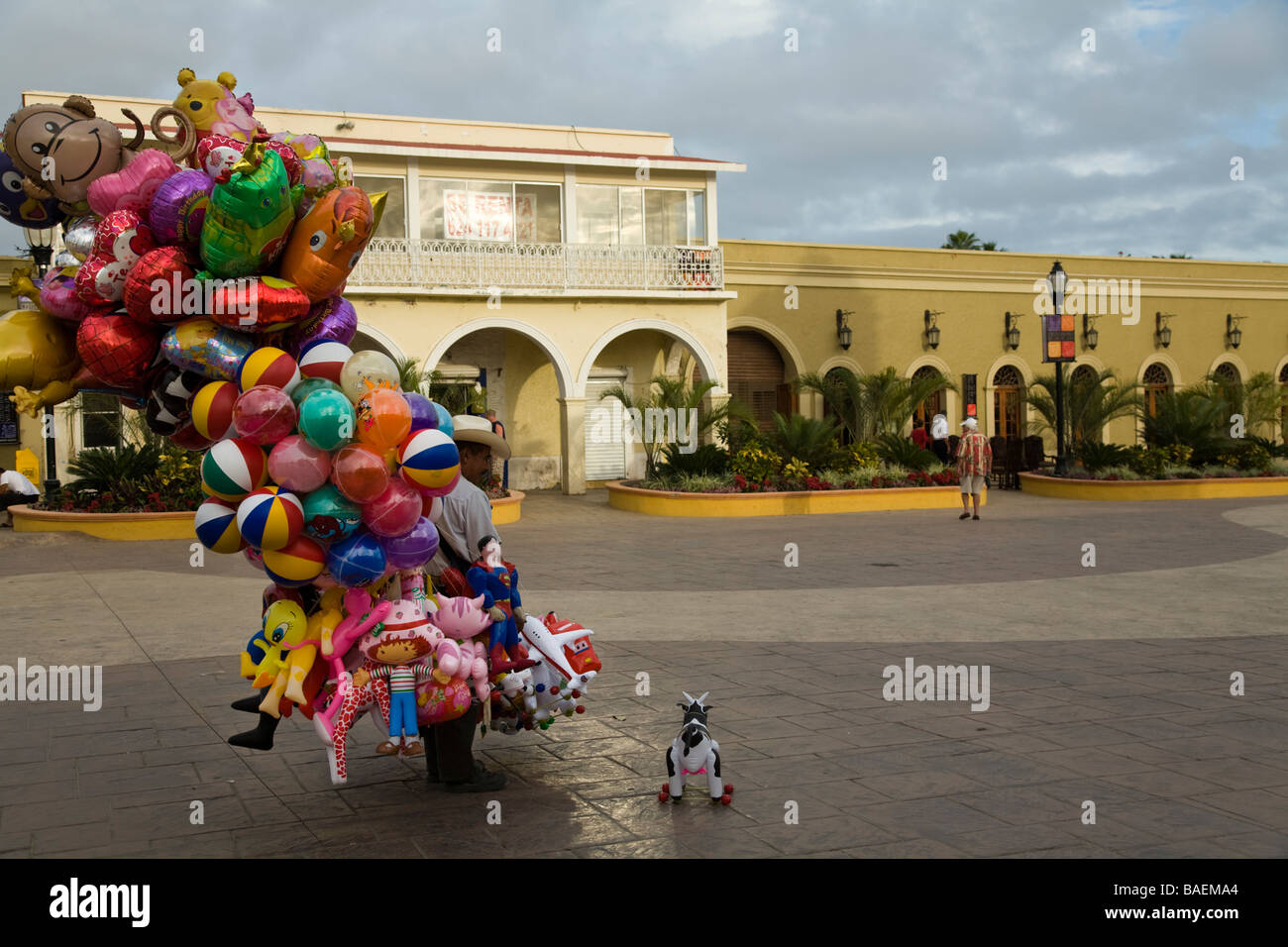 MEXICO San Jose del Cabo Mexican man carrying balloons and toys for children standing in downtown plaza Stock Photo