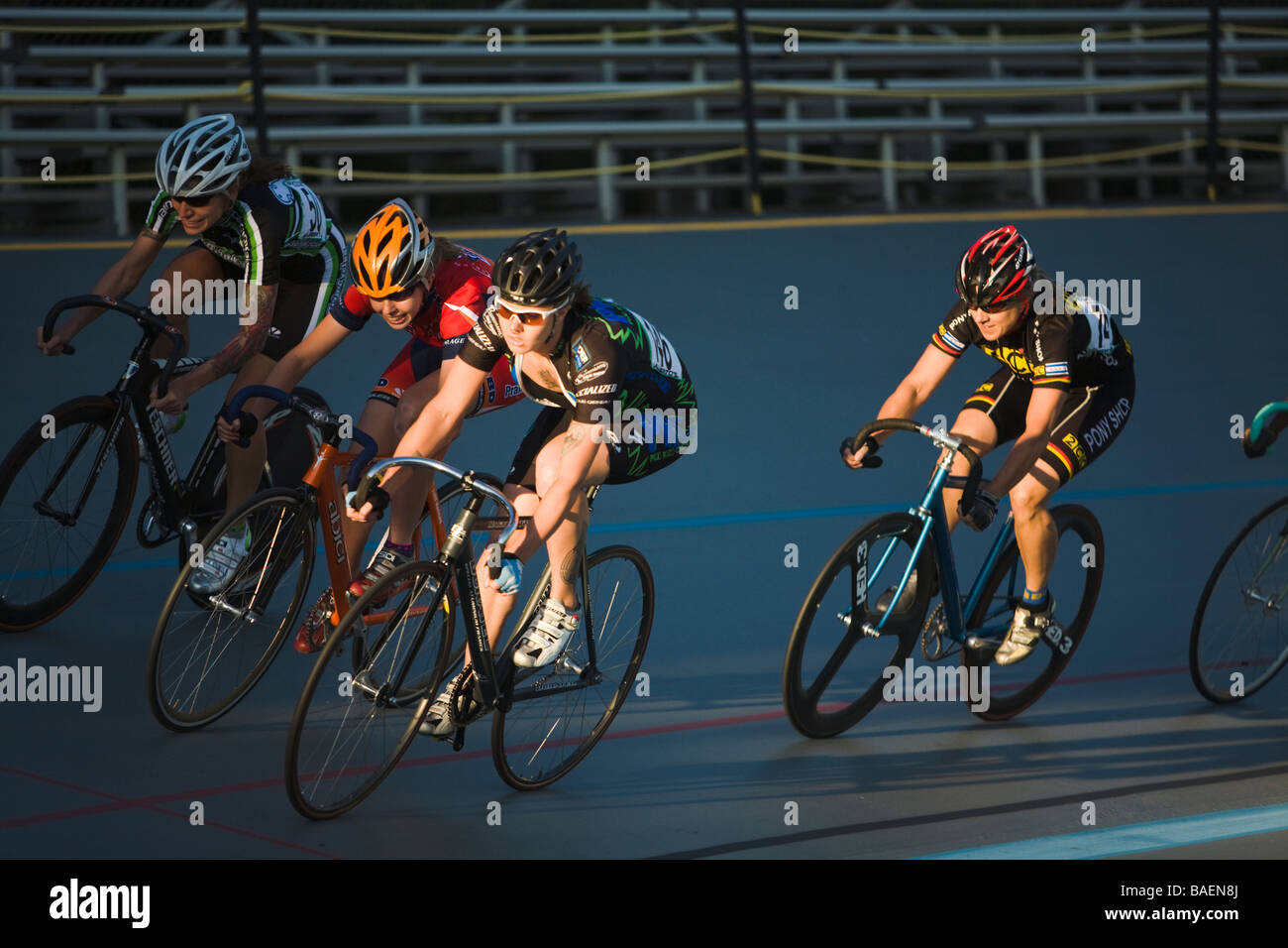 ILLINOIS Northbrook Group of women cyclists on curve in bicycle race at velodrome track Stock Photo