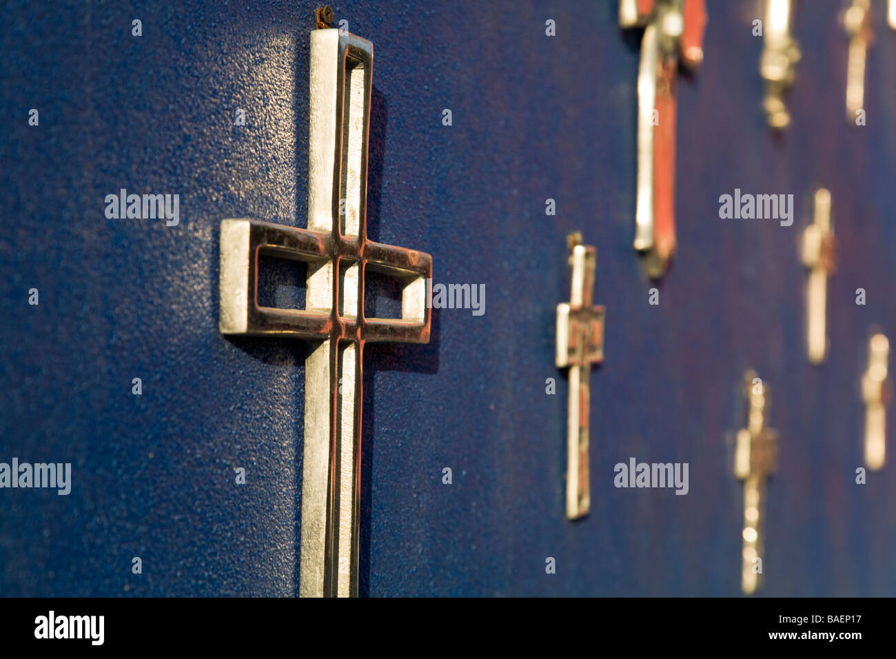 Mexico Todos Santos Silver Mexican Crosses Hanging On Blue Wall
