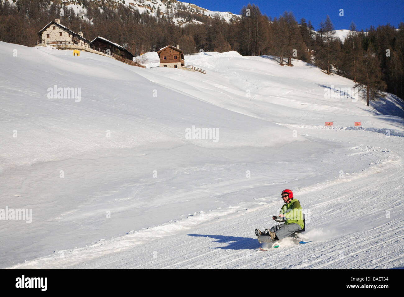 Descent with sledge, Livigno, Lombardy, Italy Stock Photo