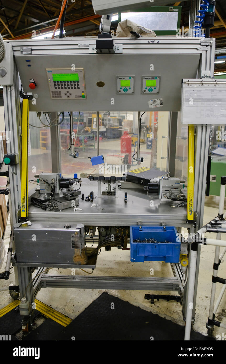 Car parts assembly station on a manufacturing production line Stock Photo