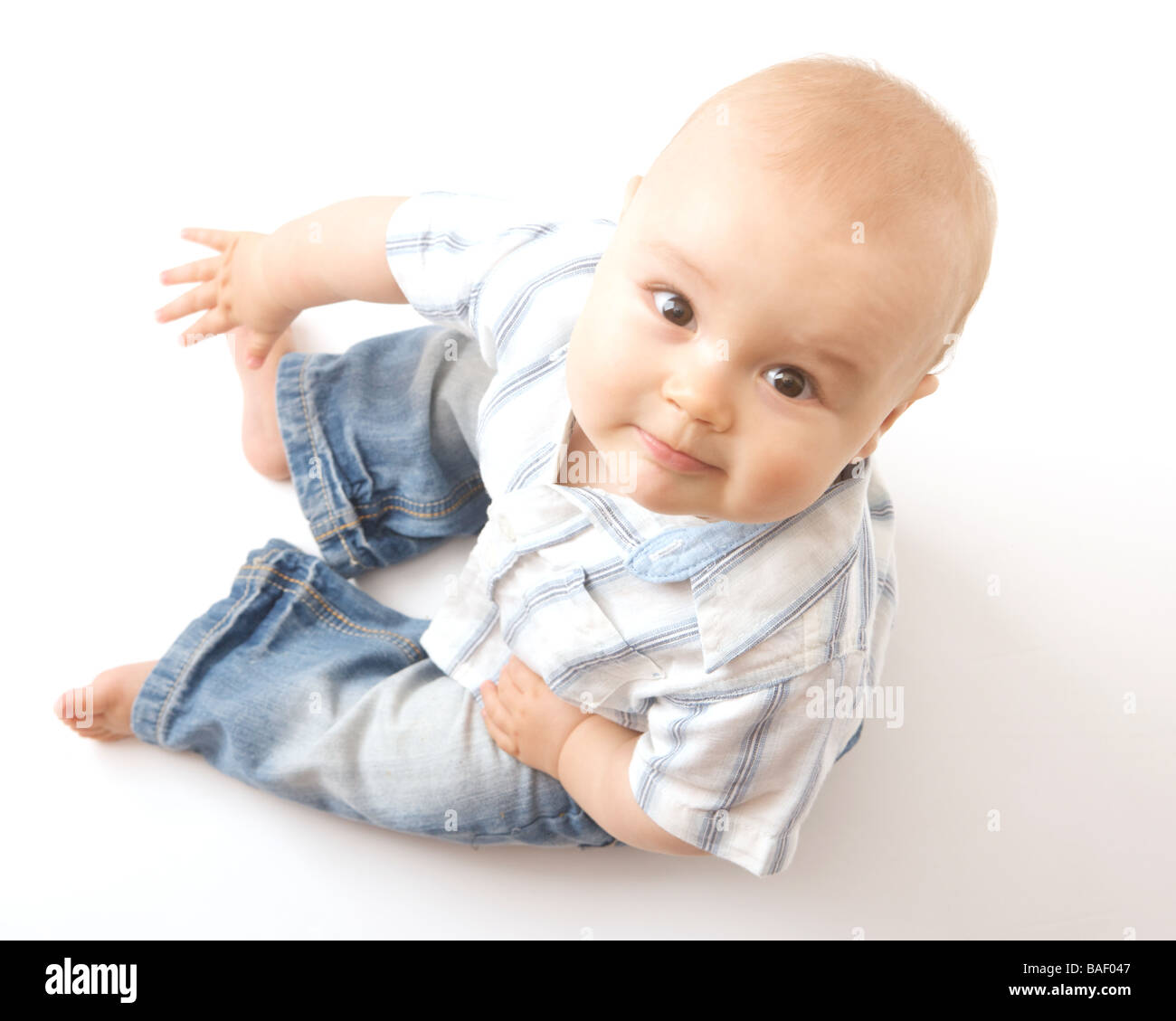 Young boy against a white background Stock Photo