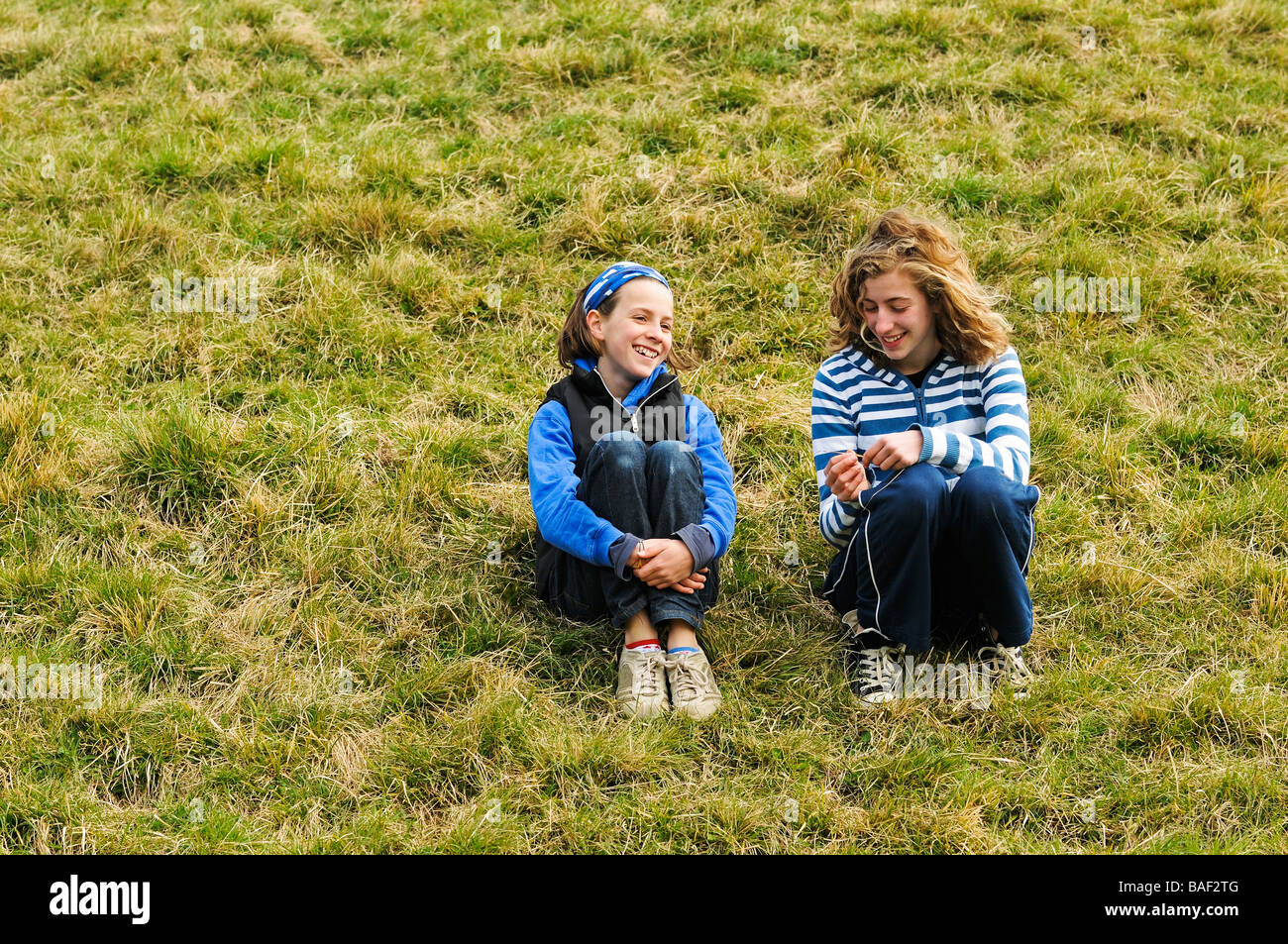 portrait of two girls chatting outside Stock Photo