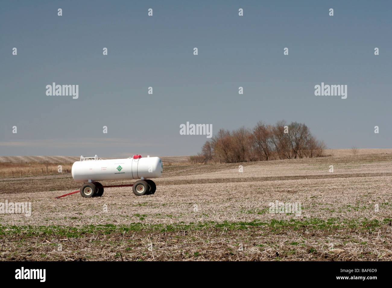 Anhydrous ammonia tank on farm in rolling hills Butler county Iowa Stock Photo