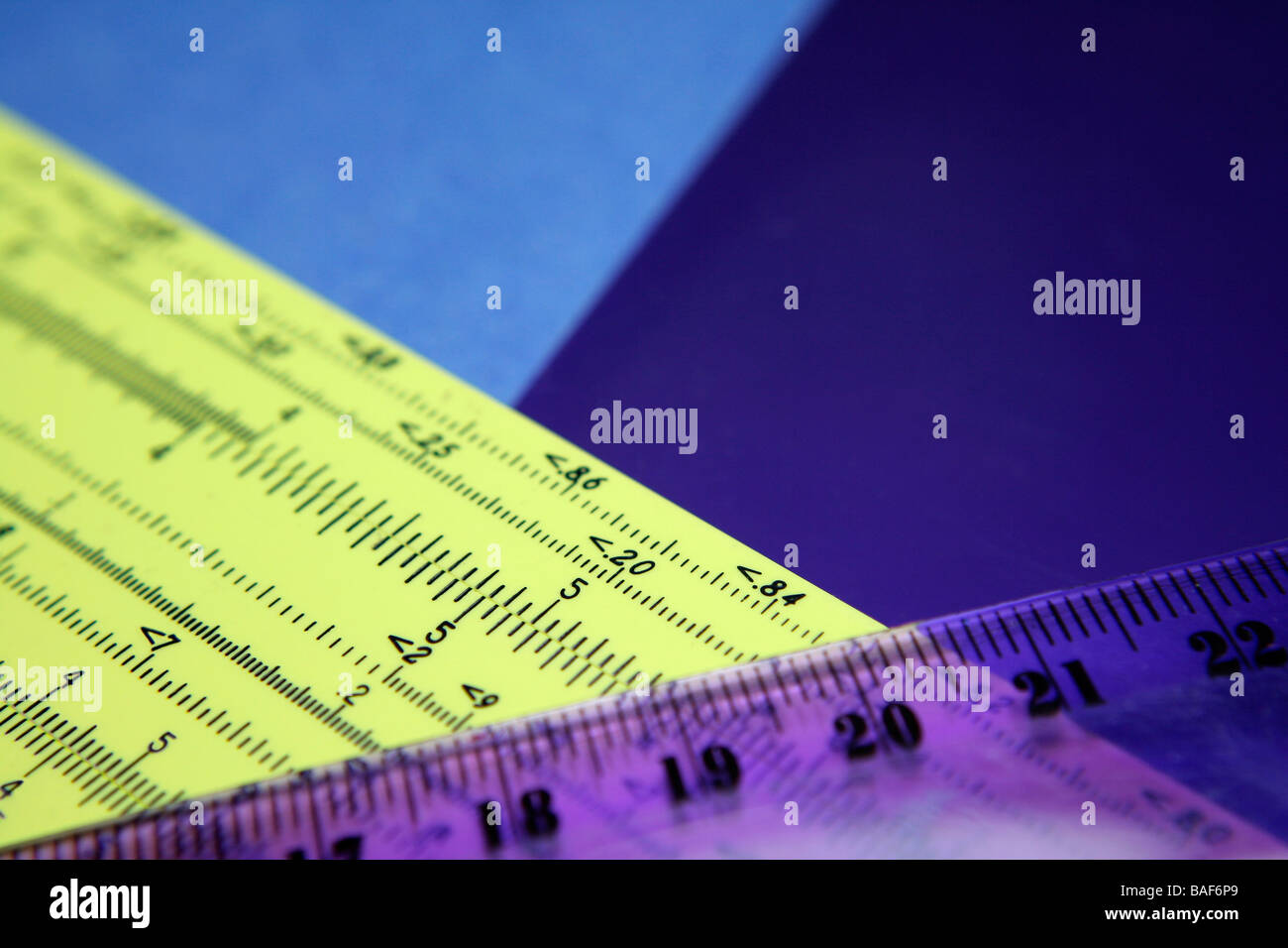 Scientific numbers on slide rule and ruler, abstract Stock Photo