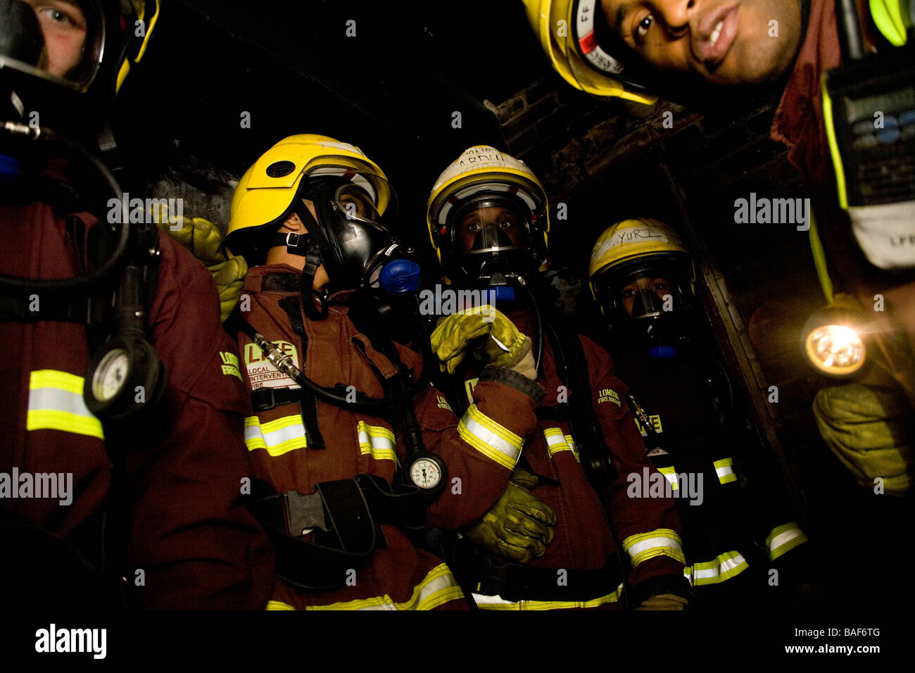 Youth offenders on fire brigade training course Stock Photo
