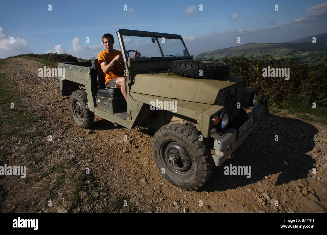 Young man driving an old series 3 Landrover Lightweight - Ex-Military Stock Photo