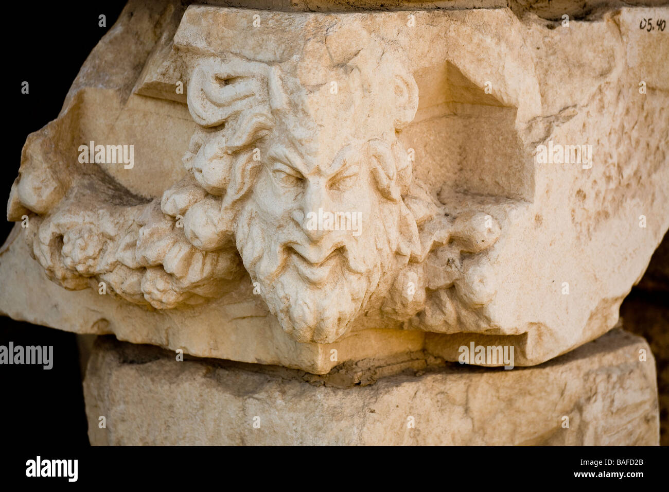 Corner Nose. A long pointed nose marks the corner of a building in this carving from the artist colony and school at Aphrodisias Stock Photo