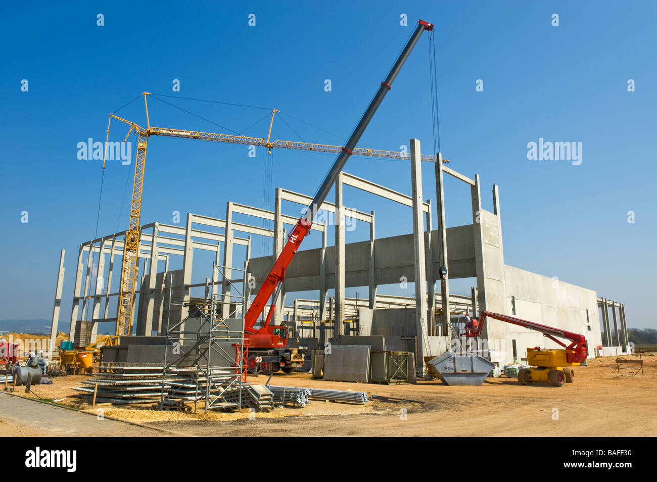 building site construction site factory plant structure skeleton steel girder works new modern building house INVESTMENT industr Stock Photo