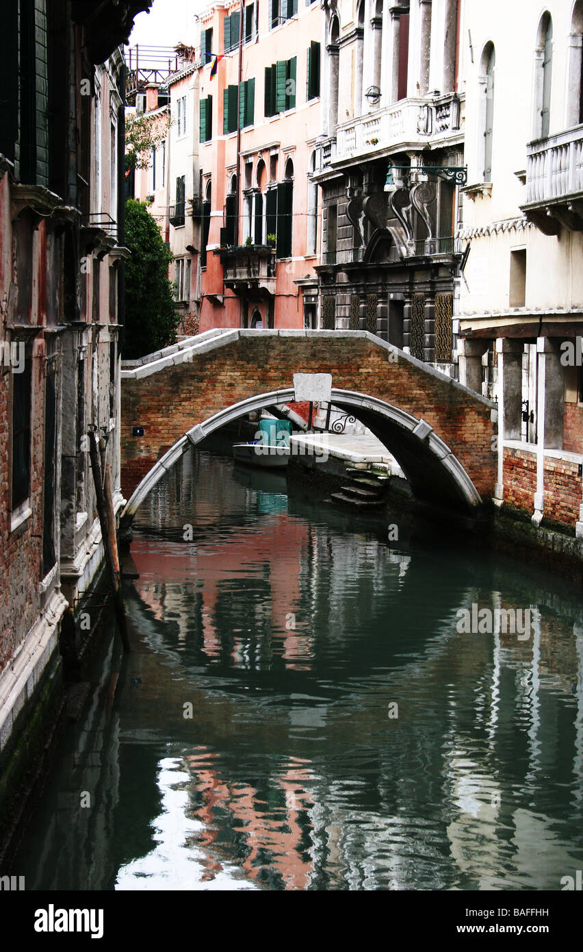 Small bridge and reflection in canal Venice Italy Stock Photo