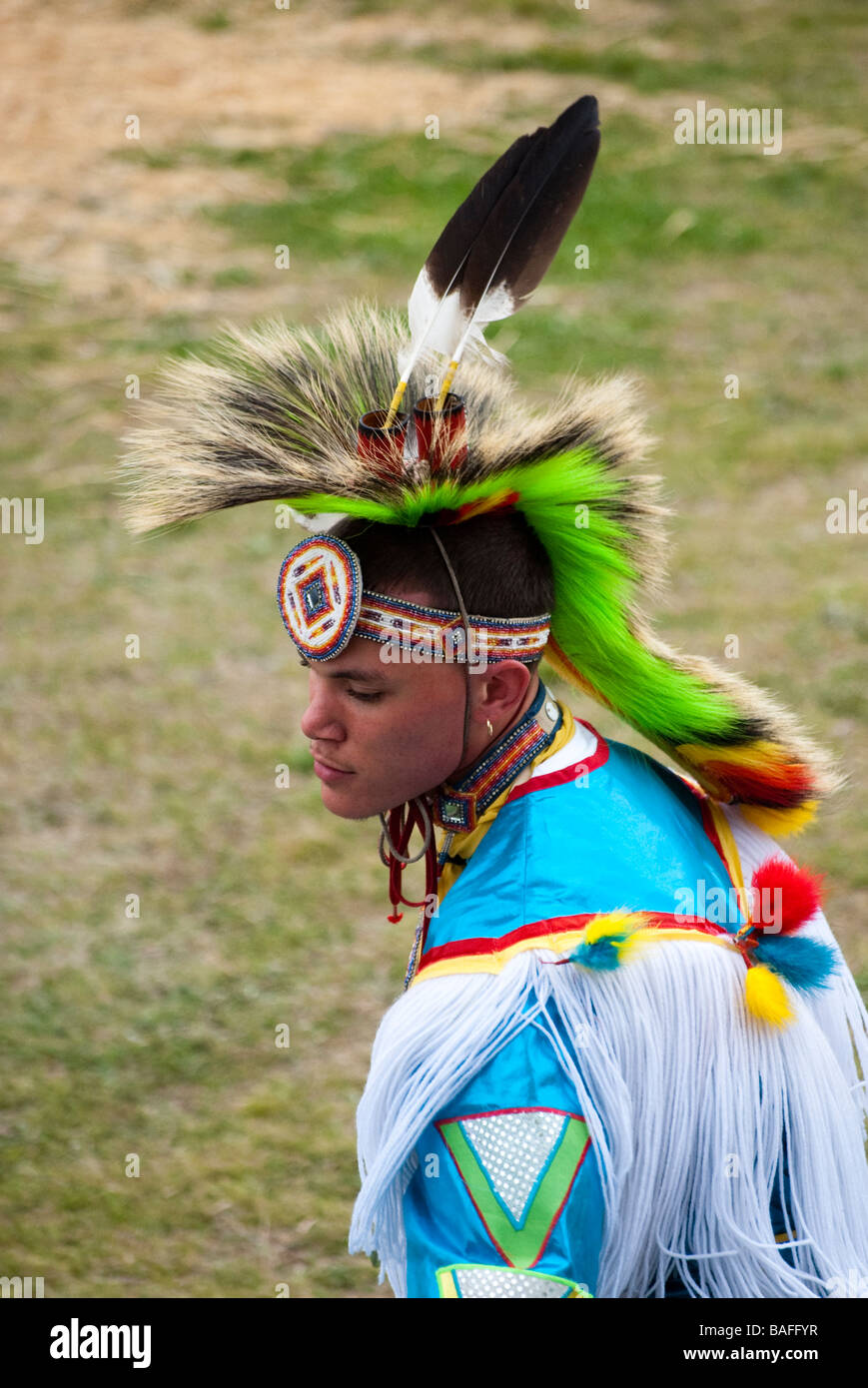 A young man of the Haliwa Saponi Indian Tribe in North Carolina wearing a  colorful costume during their 44th Annual Powwow Stock Photo - Alamy